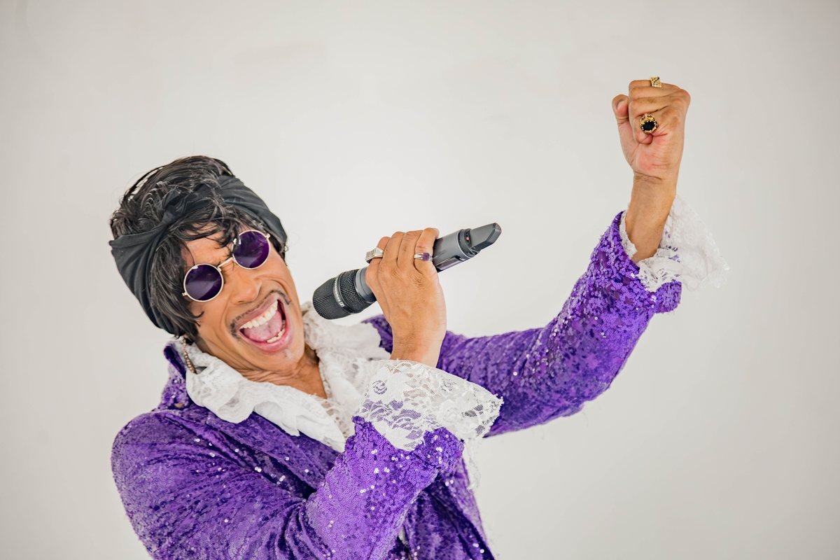 Phillip Lamar of Paizley Park performing as Prince